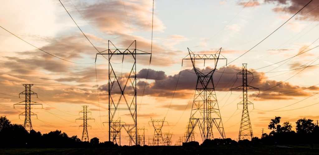 a group of power lines against the sky, symbolizing authoritarian discourse and the electrical infrastructure of control systems, networks of influence